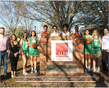 A high school women's basketball team around an Alfa Agency office sign